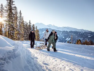 Auf der Naturrodelbahn Schnadiger Weiher © TVB Tiroler Oberland / Severin Wegener