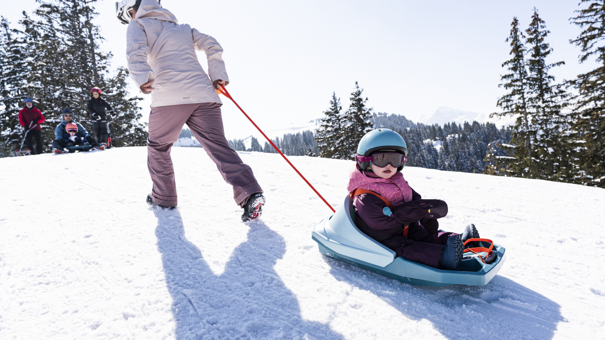 Kind auf Trilugik-Schlitten